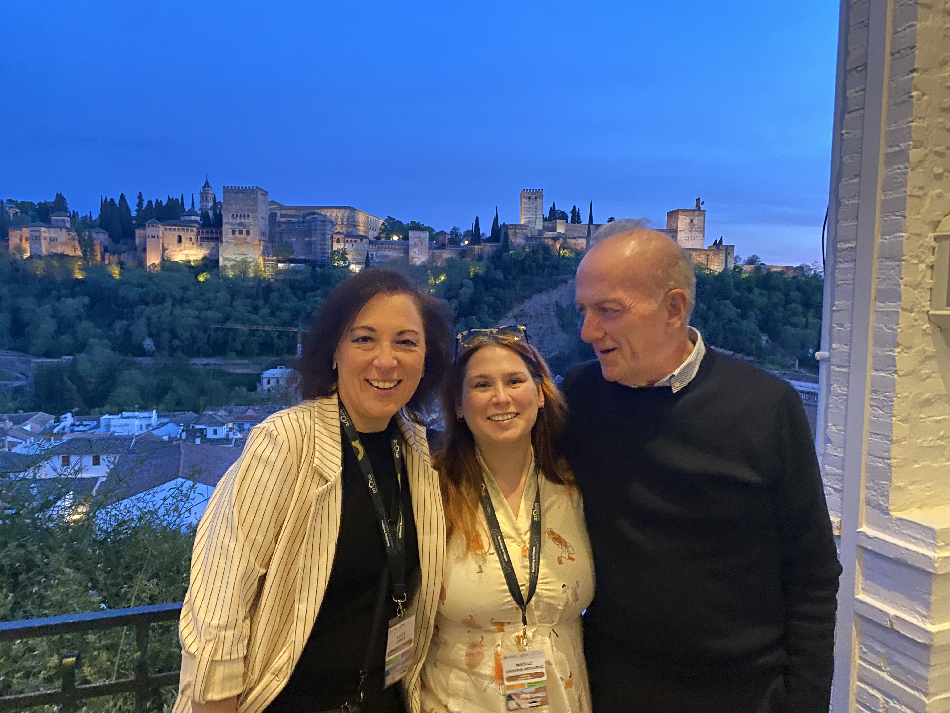 Lucía Conte (UPF), Maëlle Gibbons-Patourel (EUTOPIA Central Office) and Armando Uribe-Echeverria (EUTOPIA Comms) at a restaurant with view to the Alhambra, Granada
